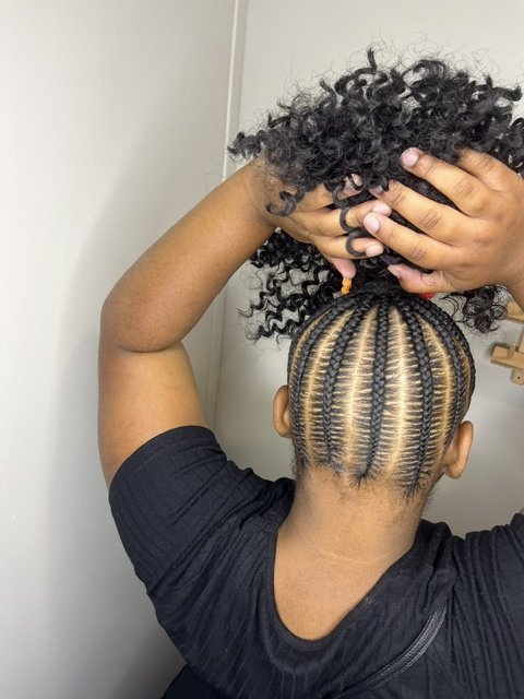 Cornrow braided ponytail with curly puff